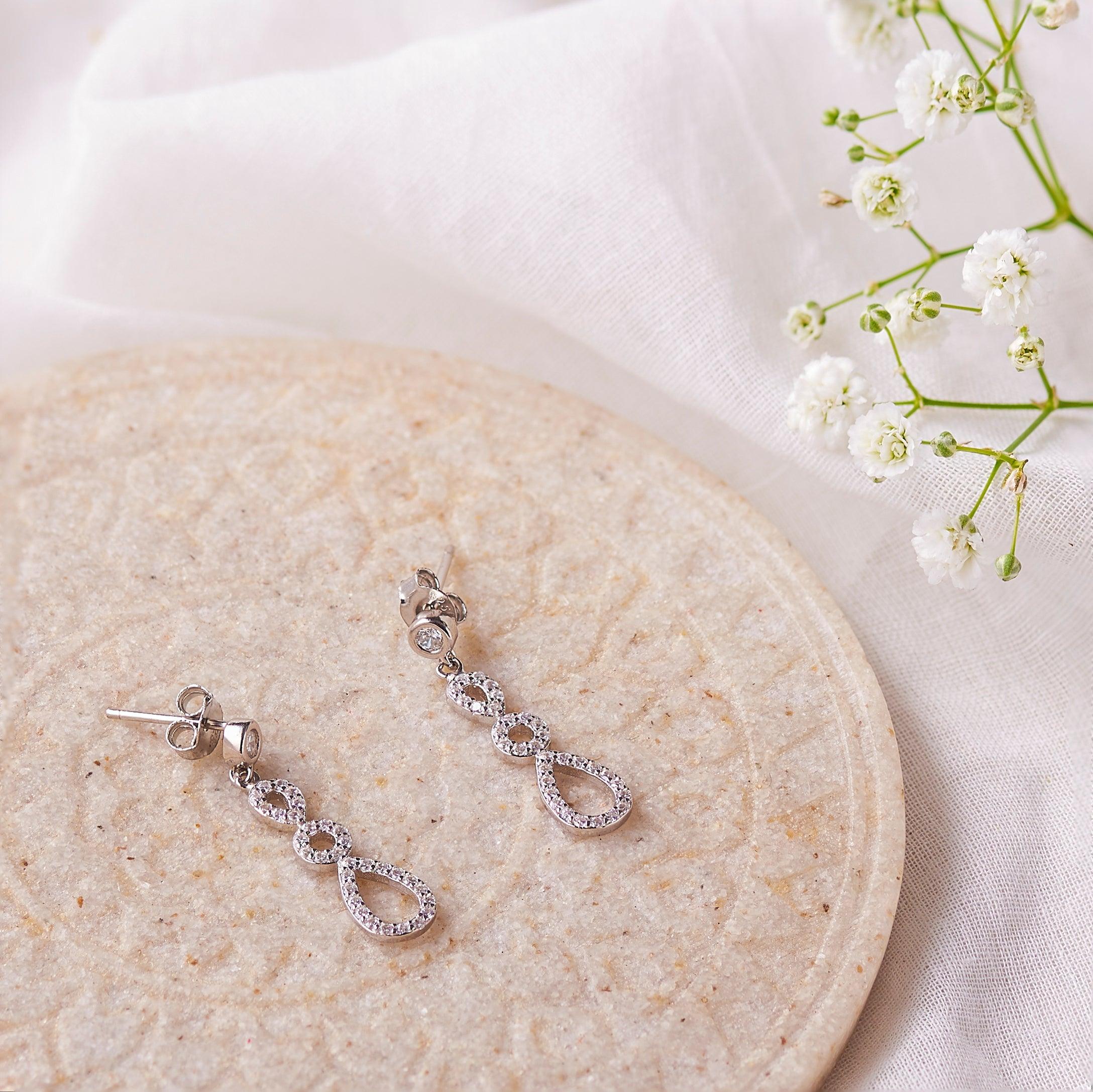 Silver Zircon Infinity Dance Earrings Dhanaza