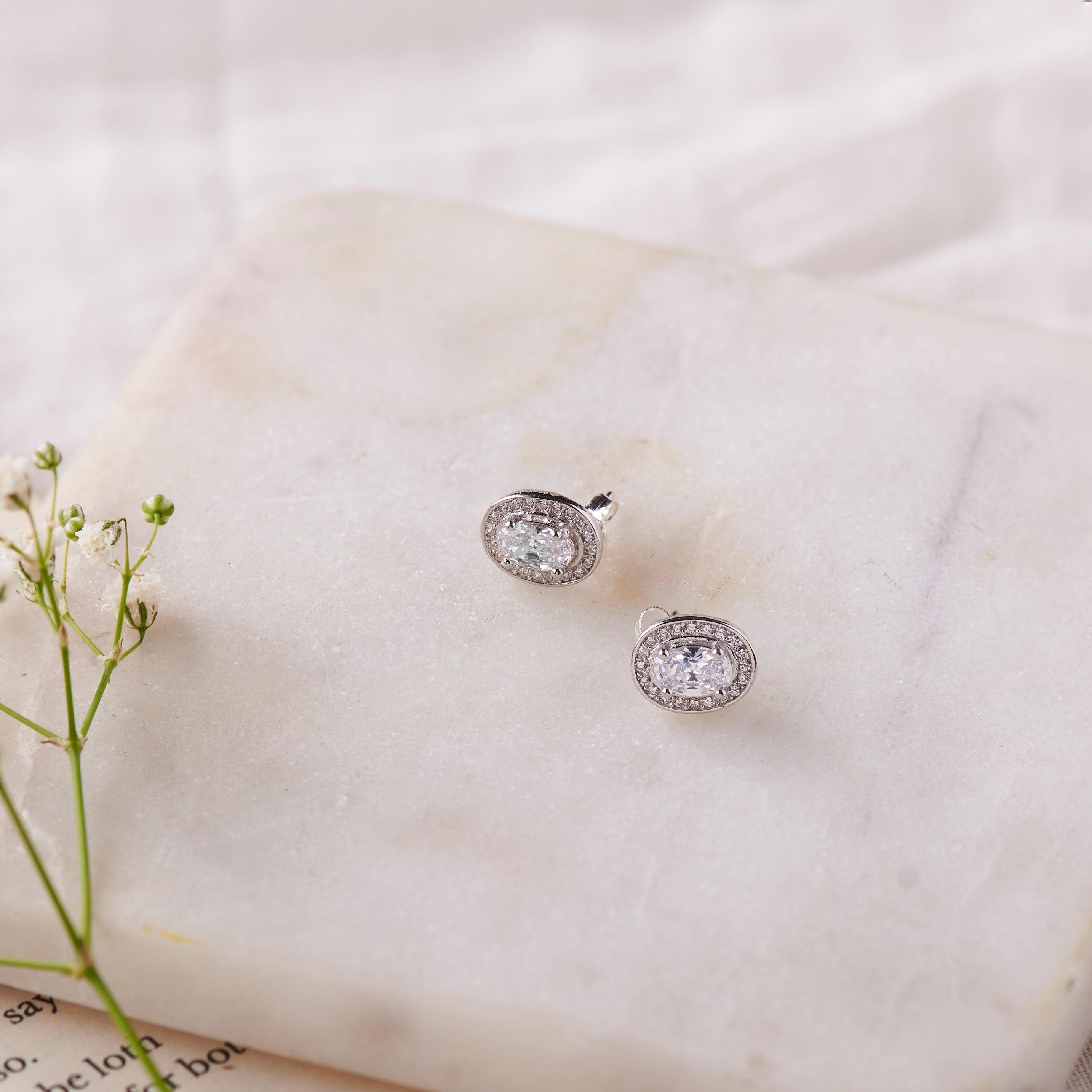 Silver Zircon Oval Halo Studs Dhanaza